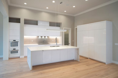 Inspiration for a contemporary l-shaped kitchen remodel in San Francisco with flat-panel cabinets and white cabinets