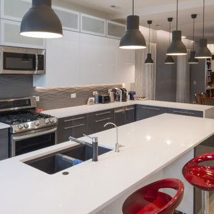 Mid-sized contemporary open concept kitchen ideas - Mid-sized trendy l-shaped porcelain tile and beige floor open concept kitchen photo in Chicago with an undermount sink, flat-panel cabinets, gray cabinets, quartz countertops, white backsplash, porcelain backsplash, stainless steel appliances, an island and white countertops