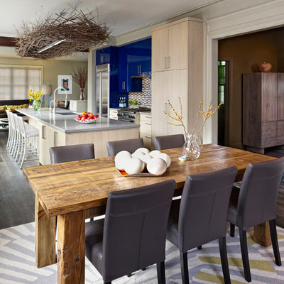 Inspiration for a contemporary galley open concept kitchen remodel in Denver with an undermount sink, flat-panel cabinets, blue cabinets, multicolored backsplash and stainless steel appliances