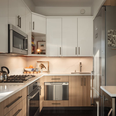 Small transitional u-shaped ceramic tile and black floor eat-in kitchen photo in New York with an undermount sink, flat-panel cabinets, light wood cabinets, quartz countertops, white backsplash, marble backsplash, stainless steel appliances, no island and gray countertops