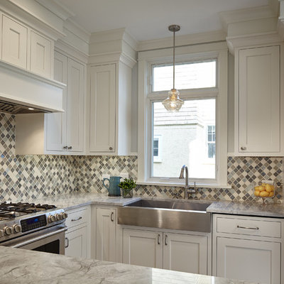 Enclosed kitchen - mid-sized transitional u-shaped dark wood floor enclosed kitchen idea in Chicago with a farmhouse sink, shaker cabinets, white cabinets, quartz countertops, multicolored backsplash, mosaic tile backsplash, stainless steel appliances and no island