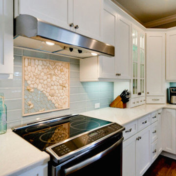A beachy mural brings the outside into this clean, bright kitchen