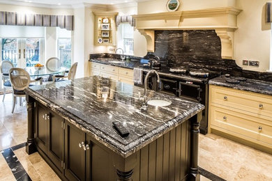 This is an example of a large modern l-shaped kitchen/diner in Other with a built-in sink, marble worktops and an island.