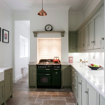 Mid-sized trendy galley limestone floor enclosed kitchen photo in Kent with a farmhouse sink, shaker cabinets, quartzite countertops, white backsplash, colored appliances, green cabinets, subway tile backsplash and white countertops