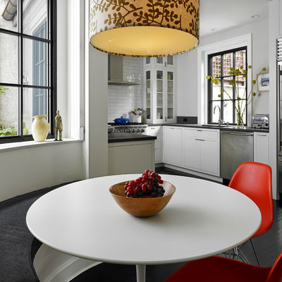Inspiration for a transitional u-shaped eat-in kitchen remodel in Philadelphia with an undermount sink, flat-panel cabinets, white cabinets, white backsplash, subway tile backsplash and stainless steel appliances