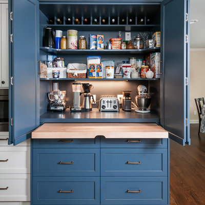 Kitchen - mid-sized transitional medium tone wood floor and brown floor kitchen idea in Atlanta with shaker cabinets, a farmhouse sink, white cabinets, quartzite countertops, white backsplash, ceramic backsplash, stainless steel appliances, no island and white countertops