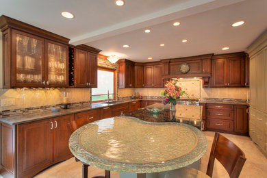 Example of a large transitional l-shaped ceramic tile eat-in kitchen design in Other with an undermount sink, raised-panel cabinets, medium tone wood cabinets, glass countertops, multicolored backsplash, mosaic tile backsplash, paneled appliances and an island