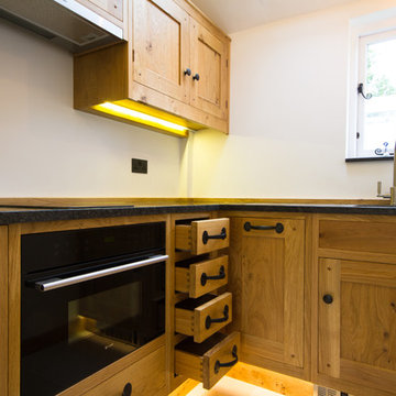 A Guesthouse With A Small Yet Beautiful Oak Kitchen And Cloakroom
