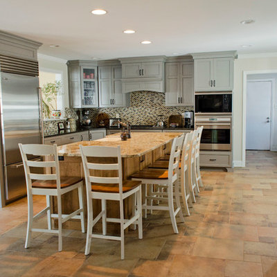 Eat-in kitchen - large transitional u-shaped porcelain tile eat-in kitchen idea in Philadelphia with mosaic tile backsplash, stainless steel appliances, a farmhouse sink, shaker cabinets, gray cabinets, granite countertops, multicolored backsplash and an island