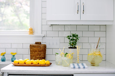 Eat-in kitchen - transitional eat-in kitchen idea in Raleigh with white backsplash