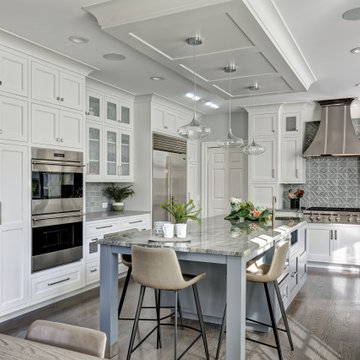A Light Filled White Kitchen with Seafoam Accents
