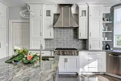 Inspiration for a large timeless u-shaped porcelain tile and gray floor eat-in kitchen remodel in New York with a double-bowl sink, flat-panel cabinets, white cabinets, quartzite countertops, green backsplash, ceramic backsplash, stainless steel appliances, an island and gray countertops