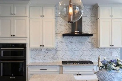 Example of a minimalist kitchen design in New York with multicolored backsplash and marble backsplash