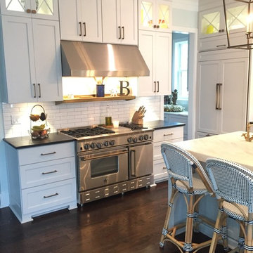 A Modern Farmhouse Kitchen with French Touches featuring a 48" BlueStar Range