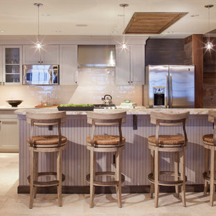 Country kitchen in Denver with beige cabinets and a peninsula.