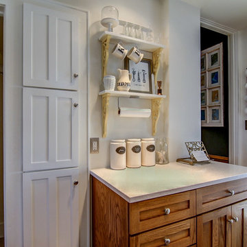 A narrow wall houses a tall spice cabinet.