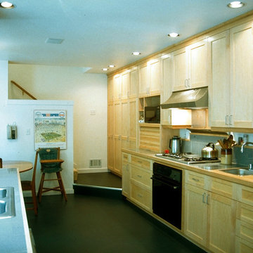 A prep sink sits next to the cooktop.