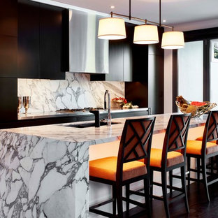 Inspiration for a large contemporary galley kitchen in Sydney with an undermount sink, flat-panel cabinets, black cabinets, panelled appliances, dark hardwood floors, with island, brown floor, grey benchtop, marble benchtops, white splashback and stone slab splashback.