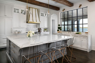 Example of a large transitional l-shaped dark wood floor eat-in kitchen design in Jacksonville with a farmhouse sink, beaded inset cabinets, white cabinets and an island