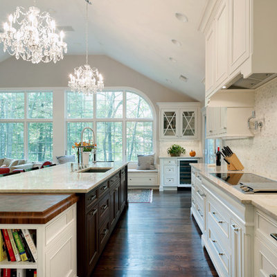 Inspiration for a timeless dark wood floor open concept kitchen remodel in Boston with an undermount sink, recessed-panel cabinets, white cabinets, quartzite countertops, white backsplash and marble backsplash