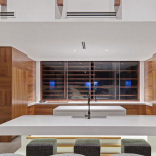Design ideas for a large contemporary u-shaped open plan kitchen in Gold Coast - Tweed with flat-panel cabinets, quartz benchtops, mirror splashback, dark hardwood floors, an undermount sink, medium wood cabinets, panelled appliances, multiple islands, grey floor and white benchtop.