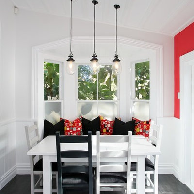 Example of a mid-sized transitional porcelain tile eat-in kitchen design in Auckland