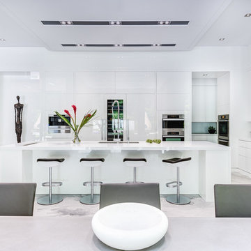 A white and modern kitchen with black details