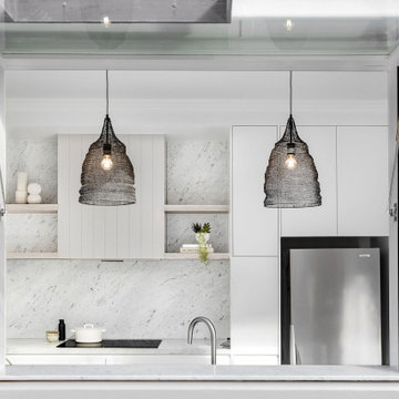 Modern grey kitchen with marble benchtops and splashback