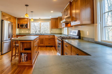 Kitchen - traditional kitchen idea in Boston with an undermount sink, shaker cabinets and stainless steel appliances