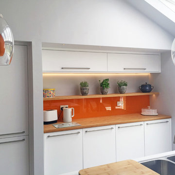 Add a splash of colour to a modern kitchen for a fun look with a retro feel