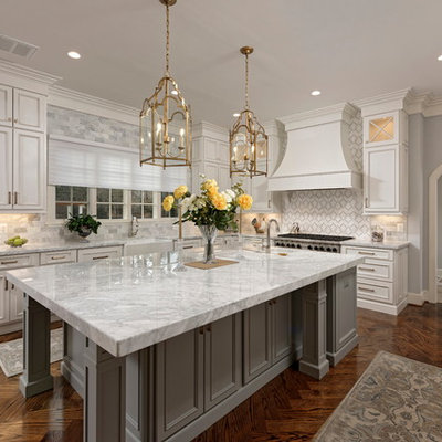 Large elegant u-shaped dark wood floor and brown floor eat-in kitchen photo in DC Metro with a farmhouse sink, recessed-panel cabinets, white cabinets, multicolored backsplash, stainless steel appliances, an island, multicolored countertops, marble countertops and mosaic tile backsplash