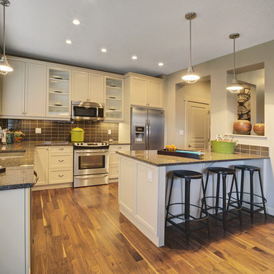 Trendy l-shaped kitchen photo in Edmonton with stainless steel appliances