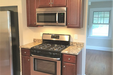 Inspiration for a small kitchen remodel in Providence with shaker cabinets and granite countertops