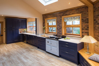Photo of a traditional kitchen/diner in Dorset with shaker cabinets.
