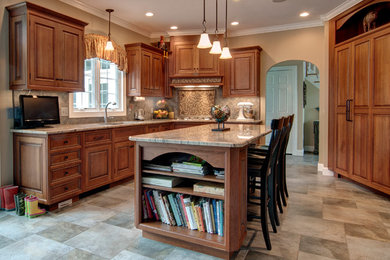 Example of a large tuscan l-shaped porcelain tile eat-in kitchen design in Boston with an undermount sink, beaded inset cabinets, medium tone wood cabinets, granite countertops, porcelain backsplash, paneled appliances, an island and multicolored backsplash