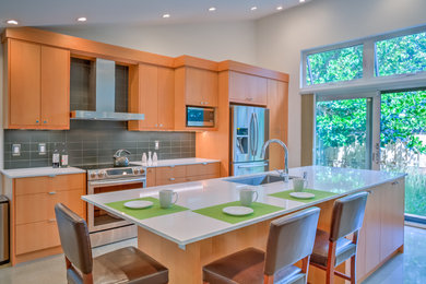 Large trendy single-wall eat-in kitchen photo in Hawaii with shaker cabinets, medium tone wood cabinets, quartz countertops, gray backsplash and an island