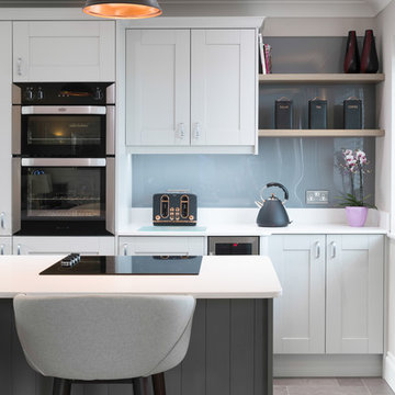 Airy open plan grey and white shaker style kitchen