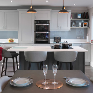 Airy open plan grey and white shaker style kitchen