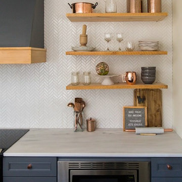 Alabama White Marble Countertops with Dark Blue Cabinets