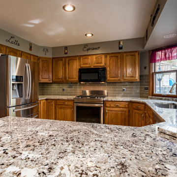 Alaska White Granite with Oak Cabinets Kitchen