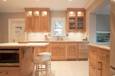 Eat-in kitchen - transitional eat-in kitchen idea in DC Metro with an undermount sink, shaker cabinets, light wood cabinets, quartzite countertops, white backsplash, glass tile backsplash and stainless steel appliances