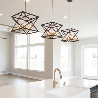 Example of a large transitional u-shaped medium tone wood floor and brown floor open concept kitchen design in Salt Lake City with a farmhouse sink, shaker cabinets, dark wood cabinets, quartz countertops, gray backsplash, ceramic backsplash, stainless steel appliances, an island and white countertops