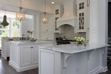 Medium sized traditional u-shaped kitchen/diner in DC Metro with a submerged sink, recessed-panel cabinets, white cabinets, quartz worktops, stone tiled splashback, coloured appliances, medium hardwood flooring and an island.