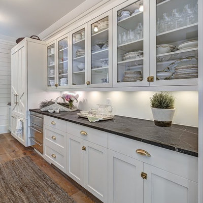 Inspiration for a large cottage single-wall medium tone wood floor eat-in kitchen remodel in Charleston with white backsplash, white cabinets, marble countertops, an island, paneled appliances and shaker cabinets