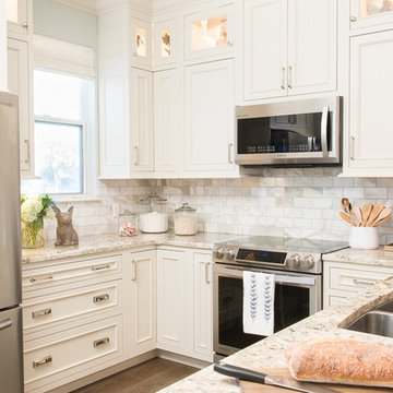 All White Cottage Style Kitchen with Stacked Cabinetry