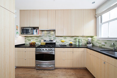 Inspiration for a small contemporary l-shaped enclosed kitchen in San Francisco with granite worktops, flat-panel cabinets, light wood cabinets, green splashback, stainless steel appliances, a submerged sink, ceramic splashback, medium hardwood flooring and no island.