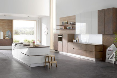 Inspiration for a medium sized modern single-wall open plan kitchen in New York with flat-panel cabinets, brown cabinets, engineered stone countertops, white splashback, glass sheet splashback, cement flooring, an island and grey floors.