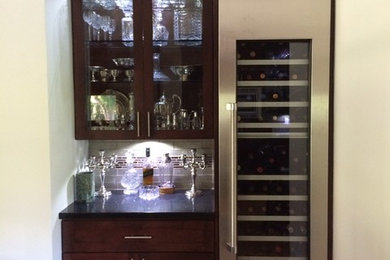 Example of a large arts and crafts medium tone wood floor home bar design in Los Angeles with shaker cabinets