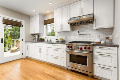 Kitchen - traditional kitchen idea in Los Angeles with subway tile backsplash