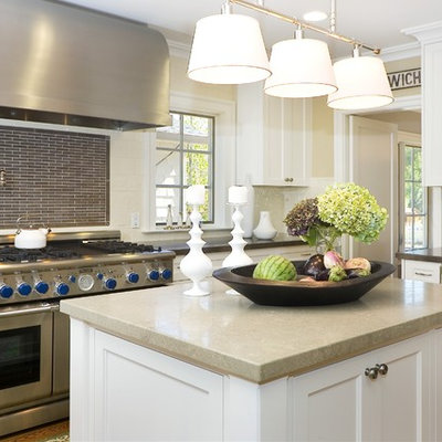 Inspiration for a contemporary enclosed kitchen remodel in San Francisco with stainless steel appliances, recessed-panel cabinets, white cabinets, multicolored backsplash and matchstick tile backsplash